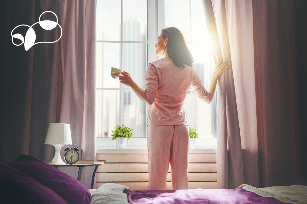 Girl looking out the window during spring