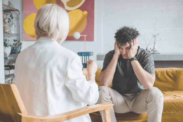 teen struggling from PTSD looking out the window