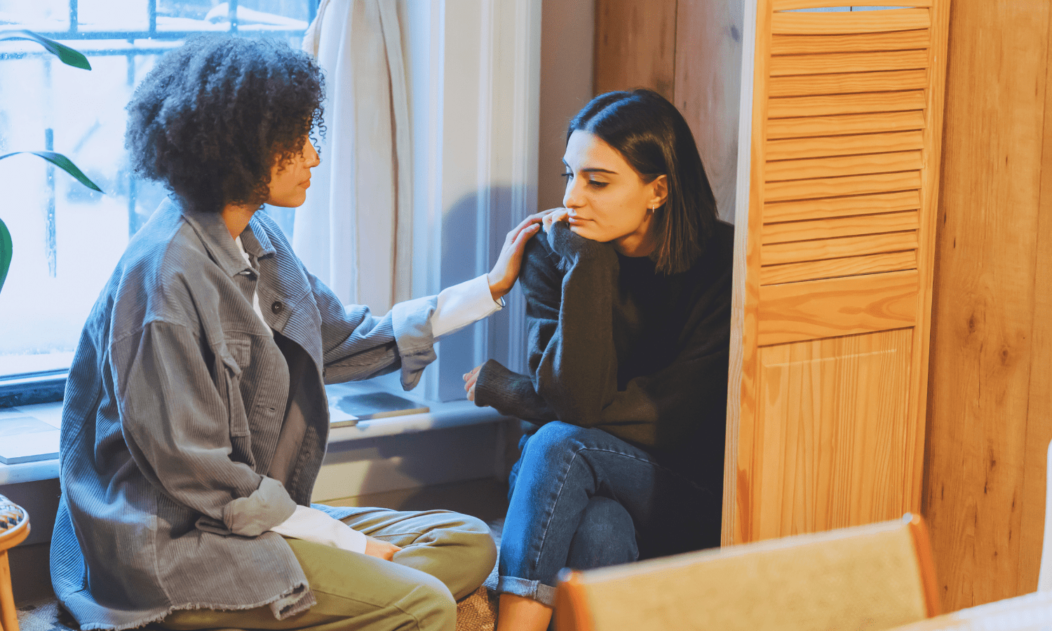 Young adult offering emotional support to a distressed friend—suicide prevention and mental health awareness conversation in progress.