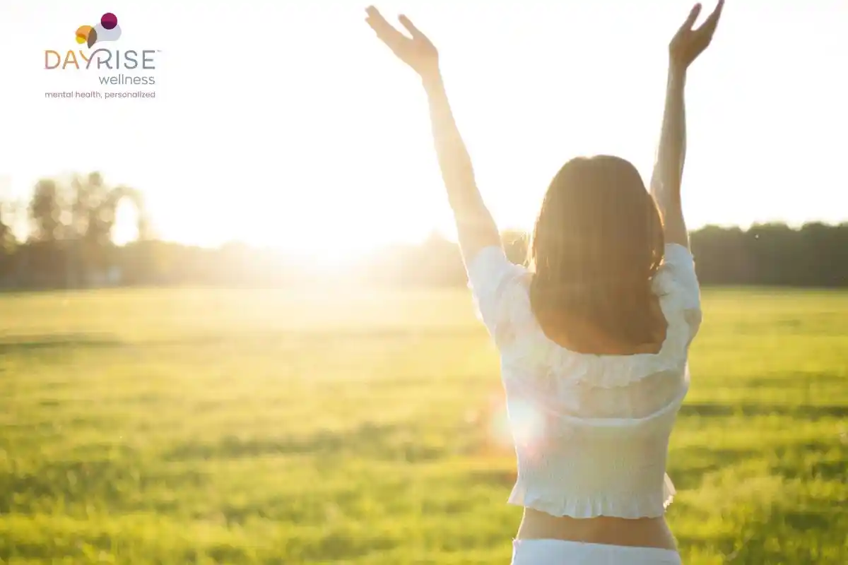 Happy girl in the sunshine due to better mental health