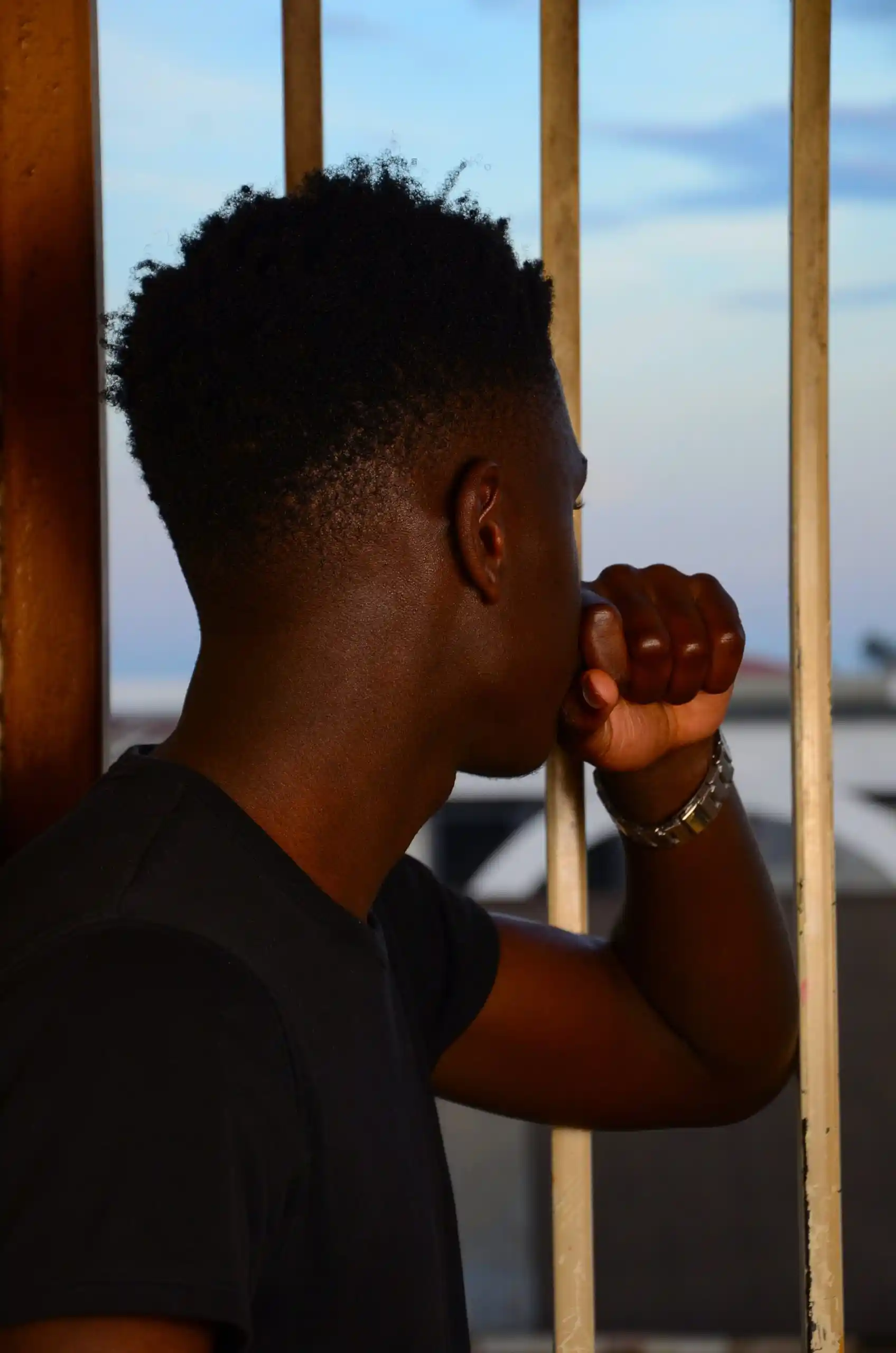 teen struggling from PTSD looking out the window